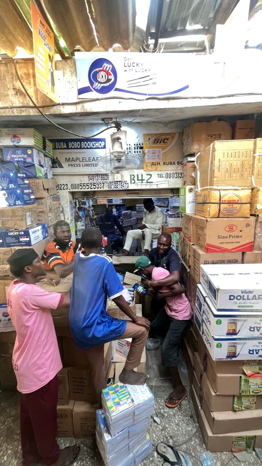 Customers being served at the front of Umar Buba Bobbo Bookshop